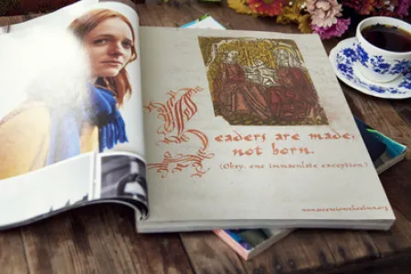 Magazine mockup featuring an advertisement for Ascension Elementary School.